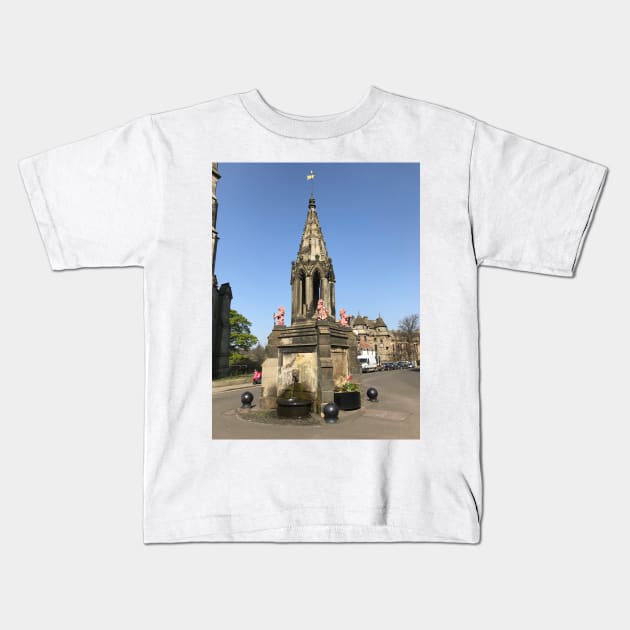 the Bruce Fountain, Falkland , Fife, Scotland Kids T-Shirt by goldyart